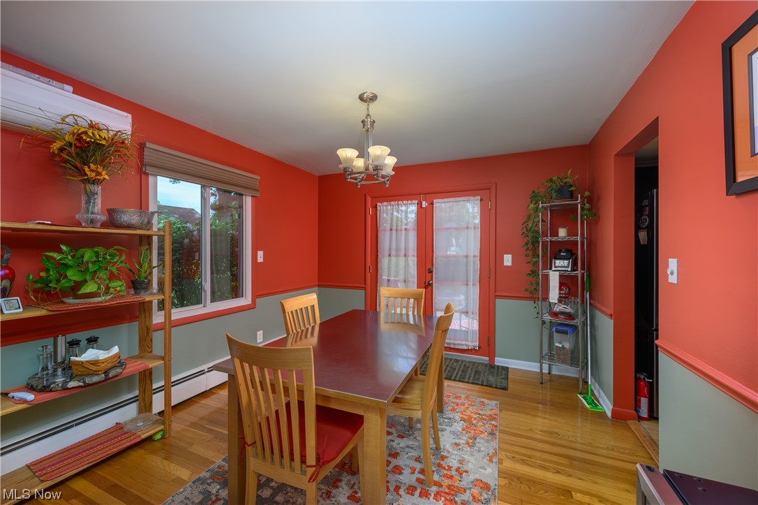 572 Overwood Road Akron, OH 44313 - Photo 10 of 35 Wood floored dining room with glass double exterior doors that lead to patio
