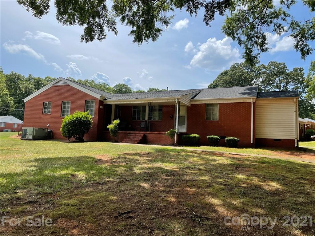 3014 Marlborough Road Charlotte, NC 28208 - Photo 1 of 1 a front view of a house with a garden and yard