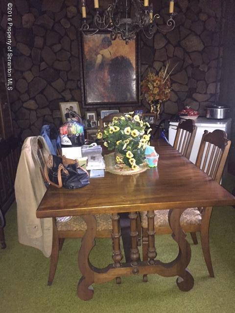 1889 Whites Ferry Road Falls, PA 18615 - Photo 8 of 23 a table with chairs and a vase of flowers