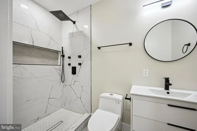 a bathroom with a shower and toilet