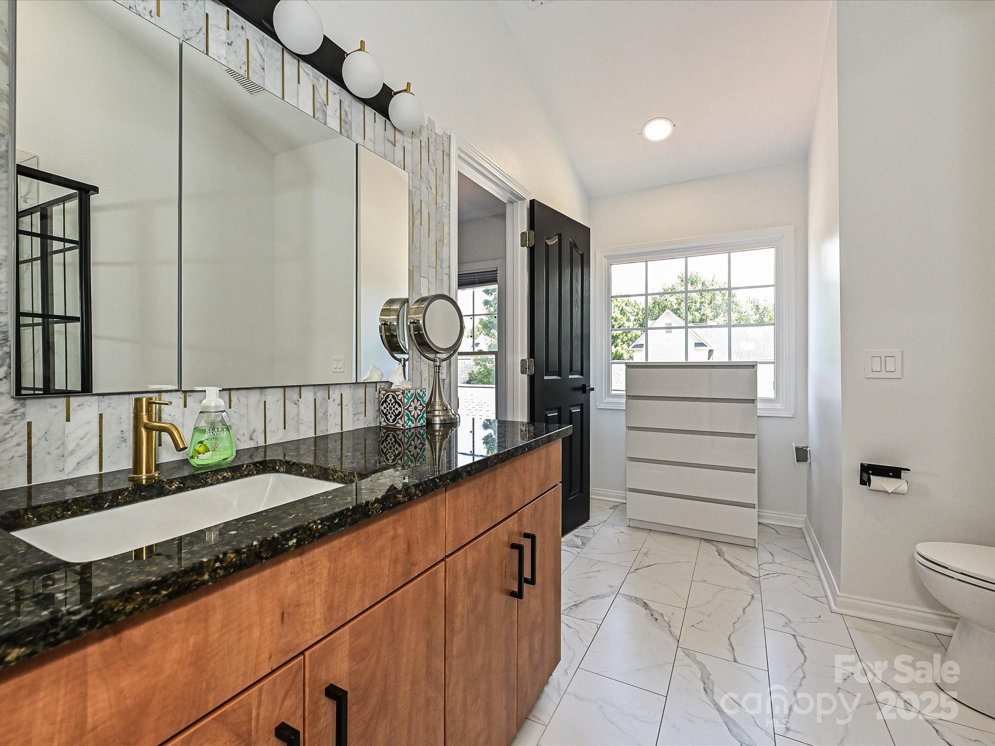 1035 Market Street Fort Mill, SC 29708 - Photo 19 of 28 a kitchen with granite countertop a stove and a sink