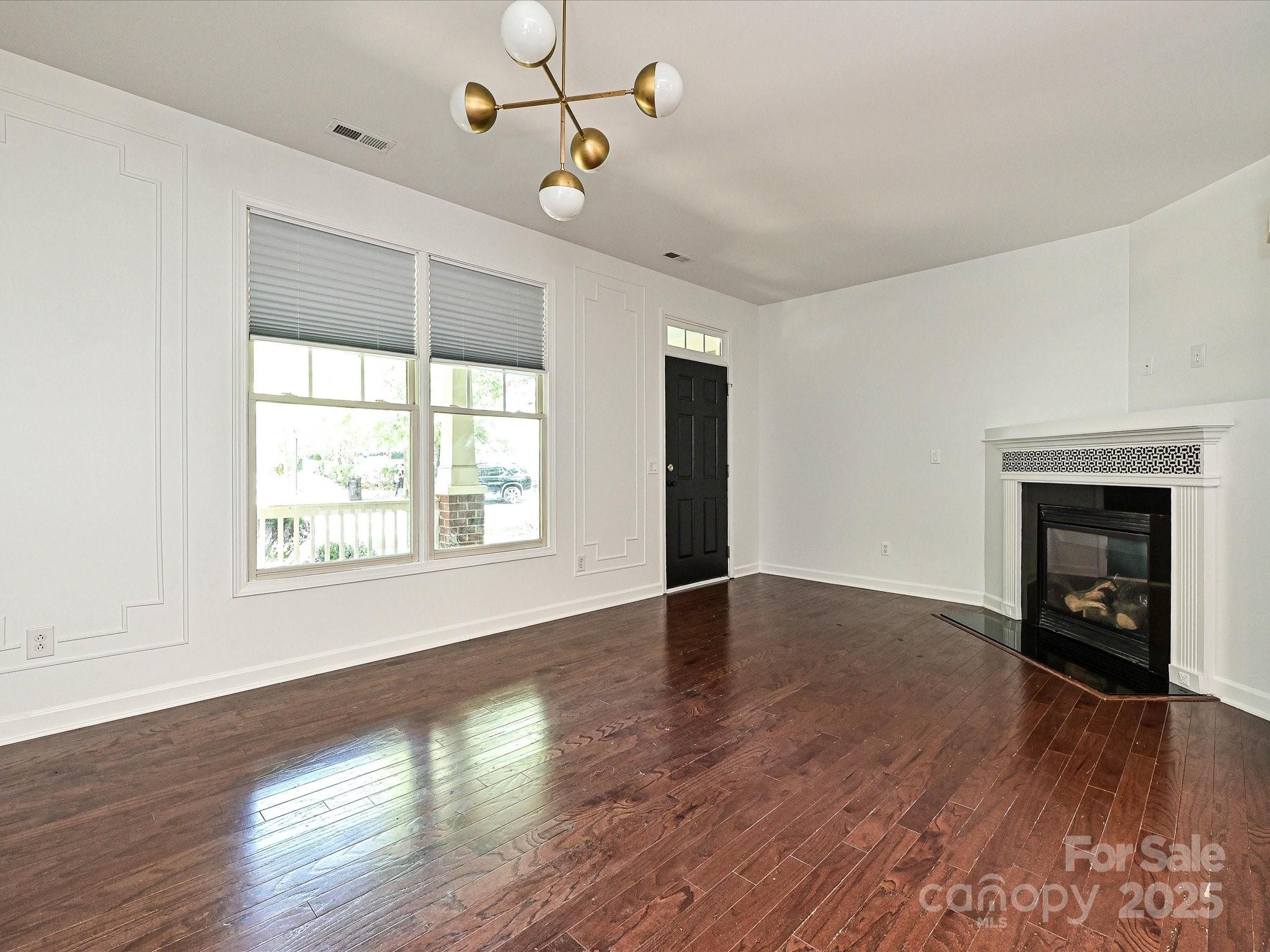 1035 Market Street Fort Mill, SC 29708 - Photo 2 of 28 a view of an empty room with wooden floor and a window