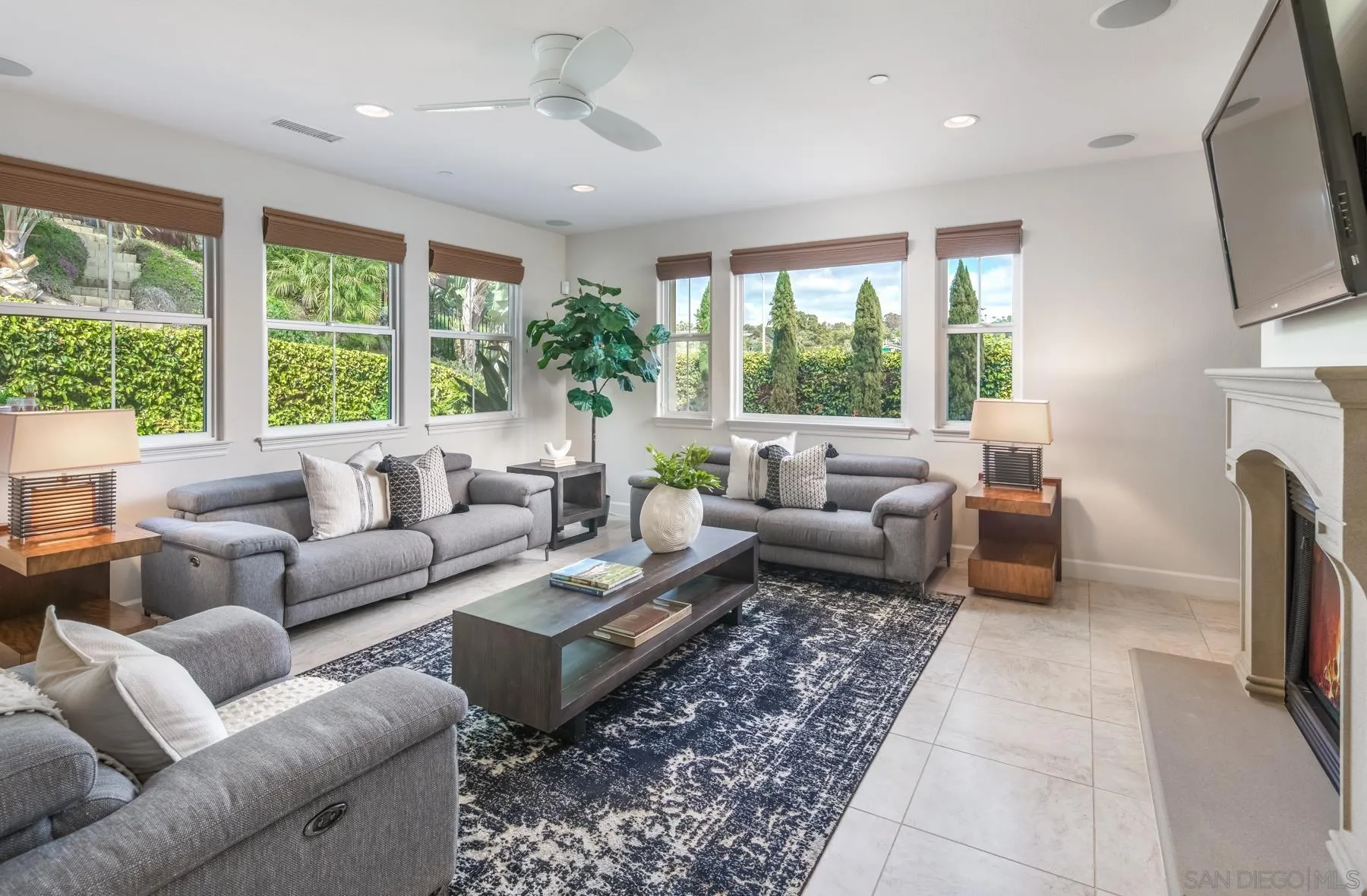 548 Quail Pointe Lane Encinitas, CA 92024 - Photo 13 of 30 a living room with furniture fireplace and a large window