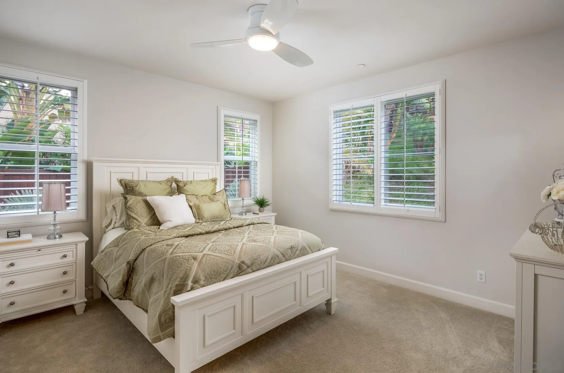 548 Quail Pointe Lane Encinitas, CA 92024 - Photo 19 of 30 a bed sitting in a bedroom next to a window