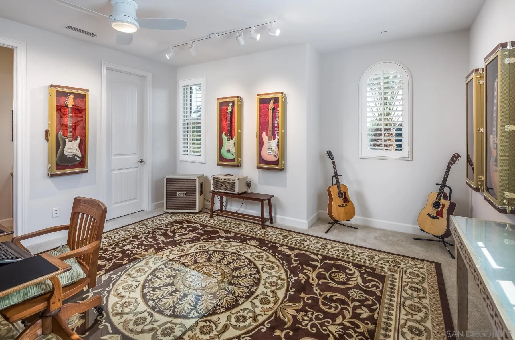 548 Quail Pointe Lane Encinitas, CA 92024 - Photo 21 of 30 a living room with furniture and a flat screen tv
