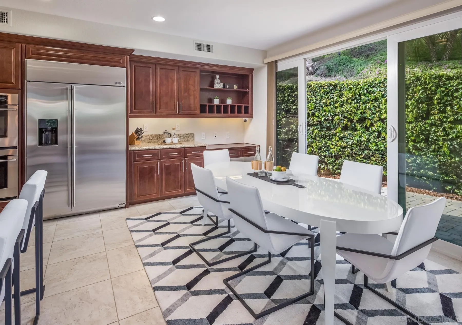 548 Quail Pointe Lane Encinitas, CA 92024 - Photo 10 of 30 a kitchen with stainless steel appliances a sink and a refrigerator