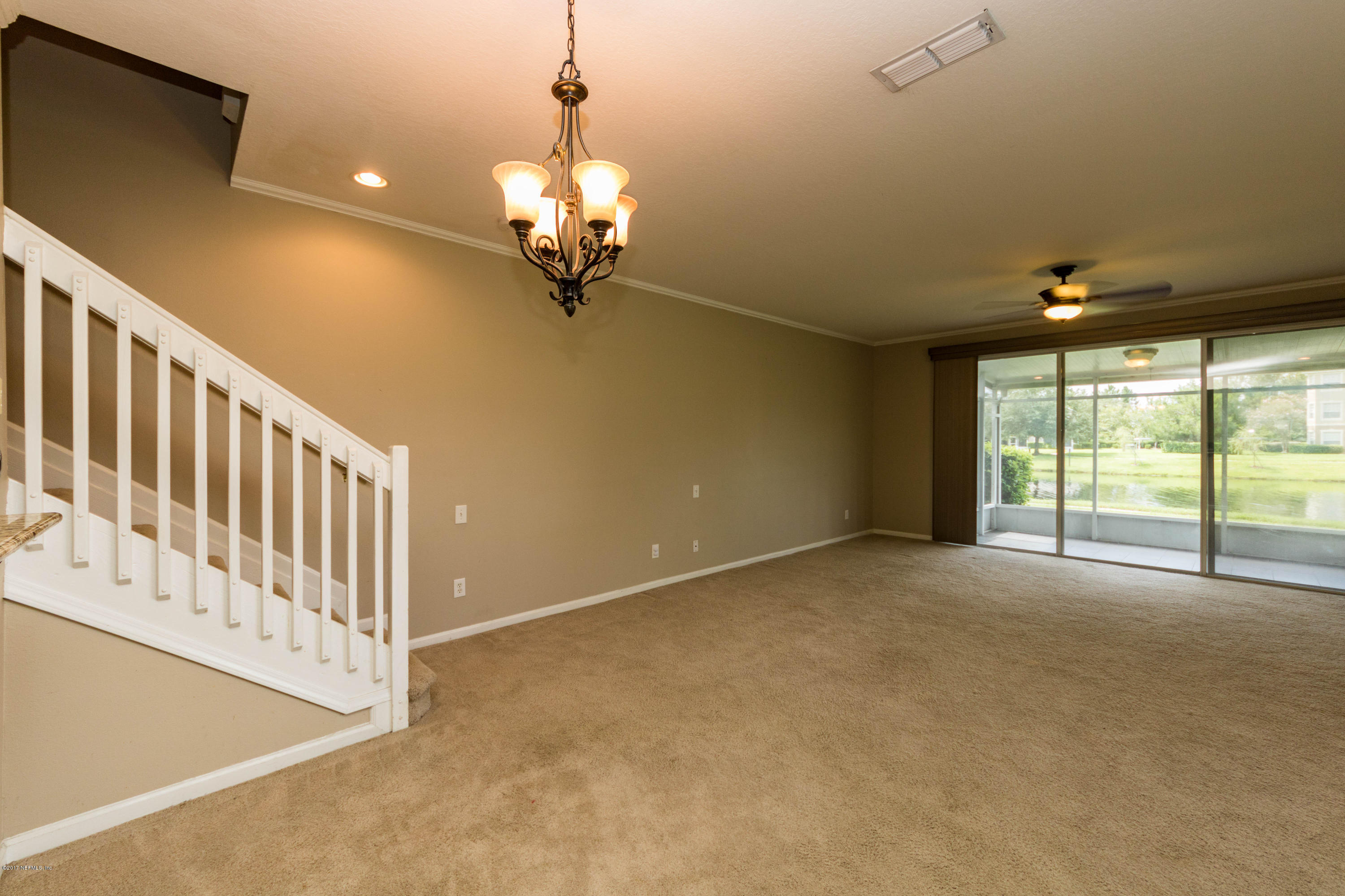 7990 Baymeadows Road East, Unit 1408 Jacksonville, FL 32256 - Photo 11 of 36 a view of an empty room with a window
