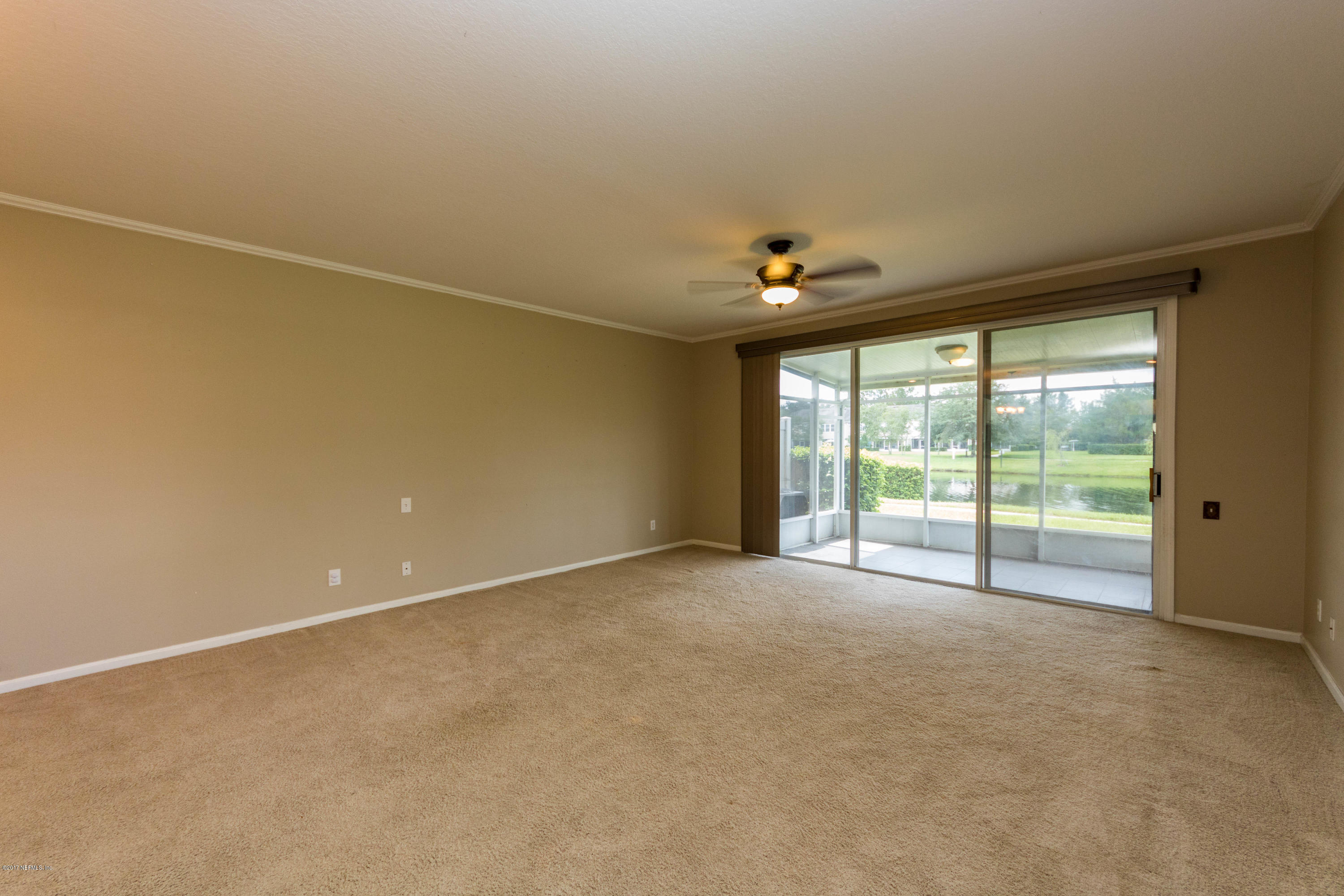 7990 Baymeadows Road East, Unit 1408 Jacksonville, FL 32256 - Photo 13 of 36 a view of an empty room with a window