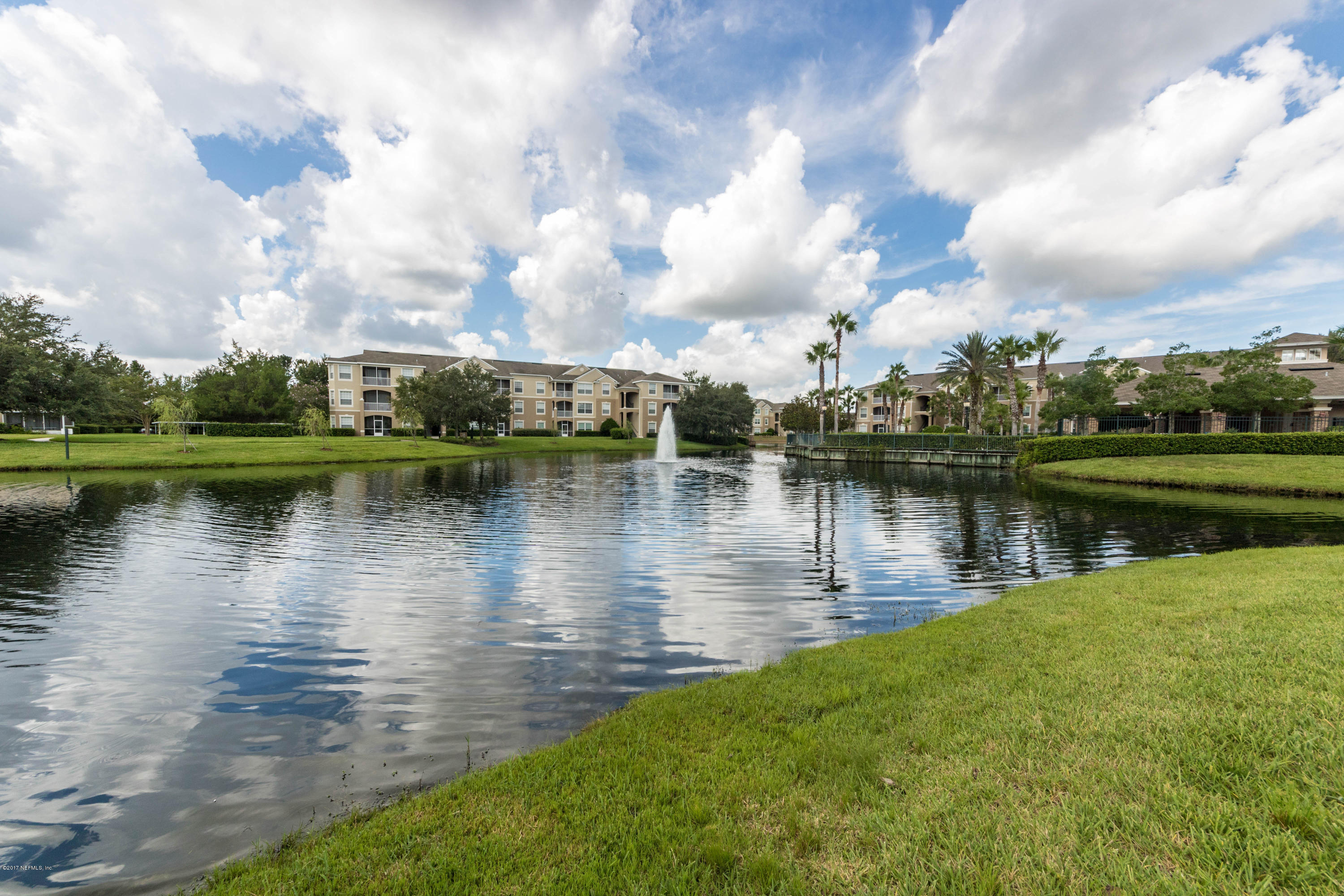 7990 Baymeadows Road East, Unit 1408 Jacksonville, FL 32256 - Photo 18 of 36 a view of a lake with houses in the background