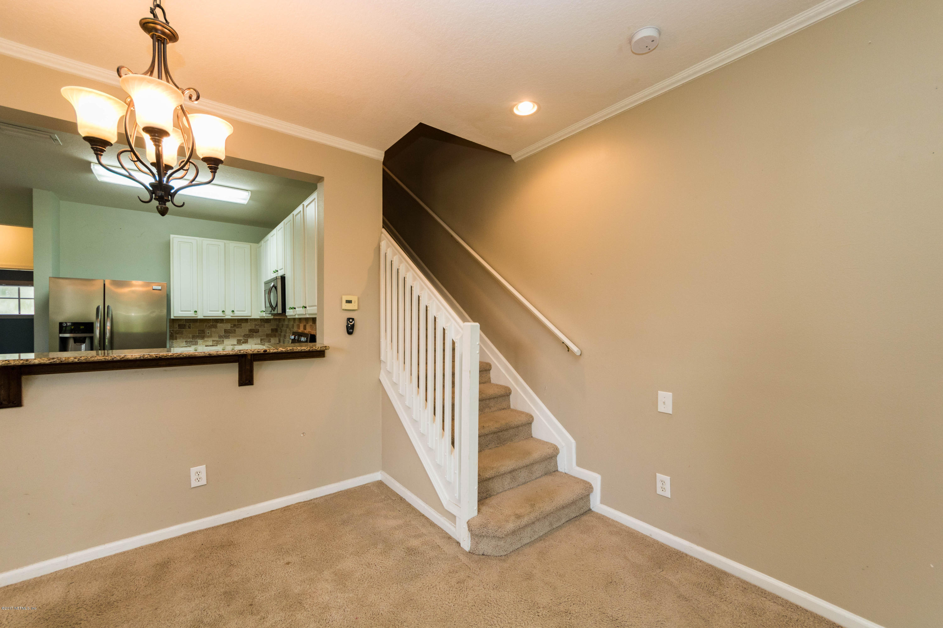 7990 Baymeadows Road East, Unit 1408 Jacksonville, FL 32256 - Photo 20 of 36 a view of a livingroom with a kitchen