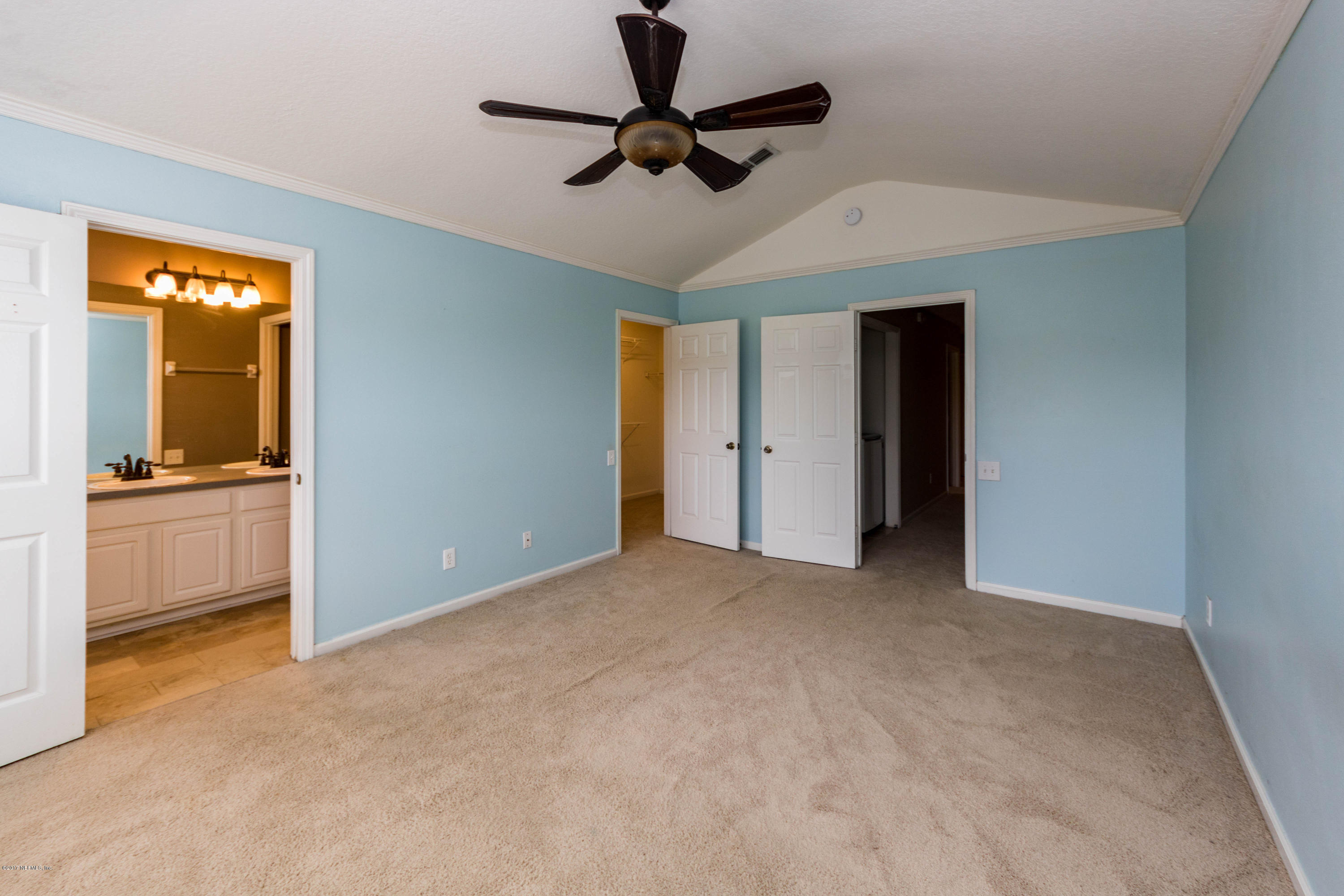 7990 Baymeadows Road East, Unit 1408 Jacksonville, FL 32256 - Photo 24 of 36 a view of an empty room with a ceiling fan