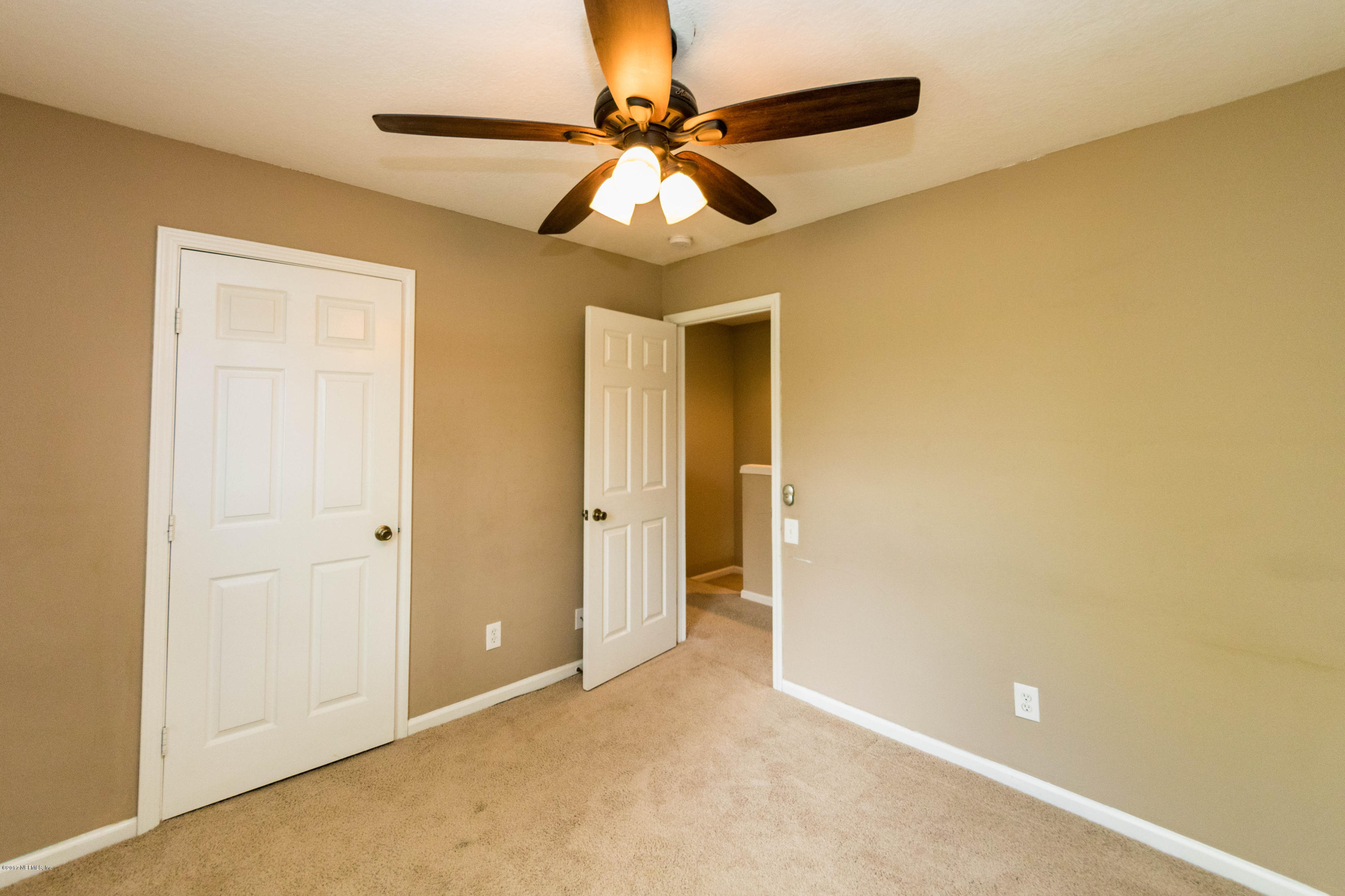 7990 Baymeadows Road East, Unit 1408 Jacksonville, FL 32256 - Photo 29 of 36 a view of livingroom with a ceiling fan and a window