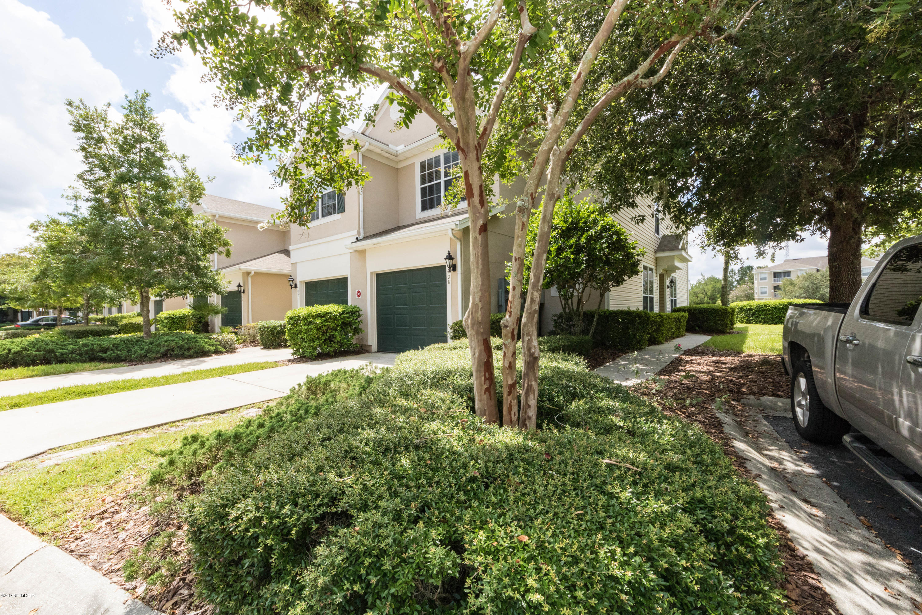 7990 Baymeadows Road East, Unit 1408 Jacksonville, FL 32256 - Photo 3 of 36 a view of backyard of house with green space