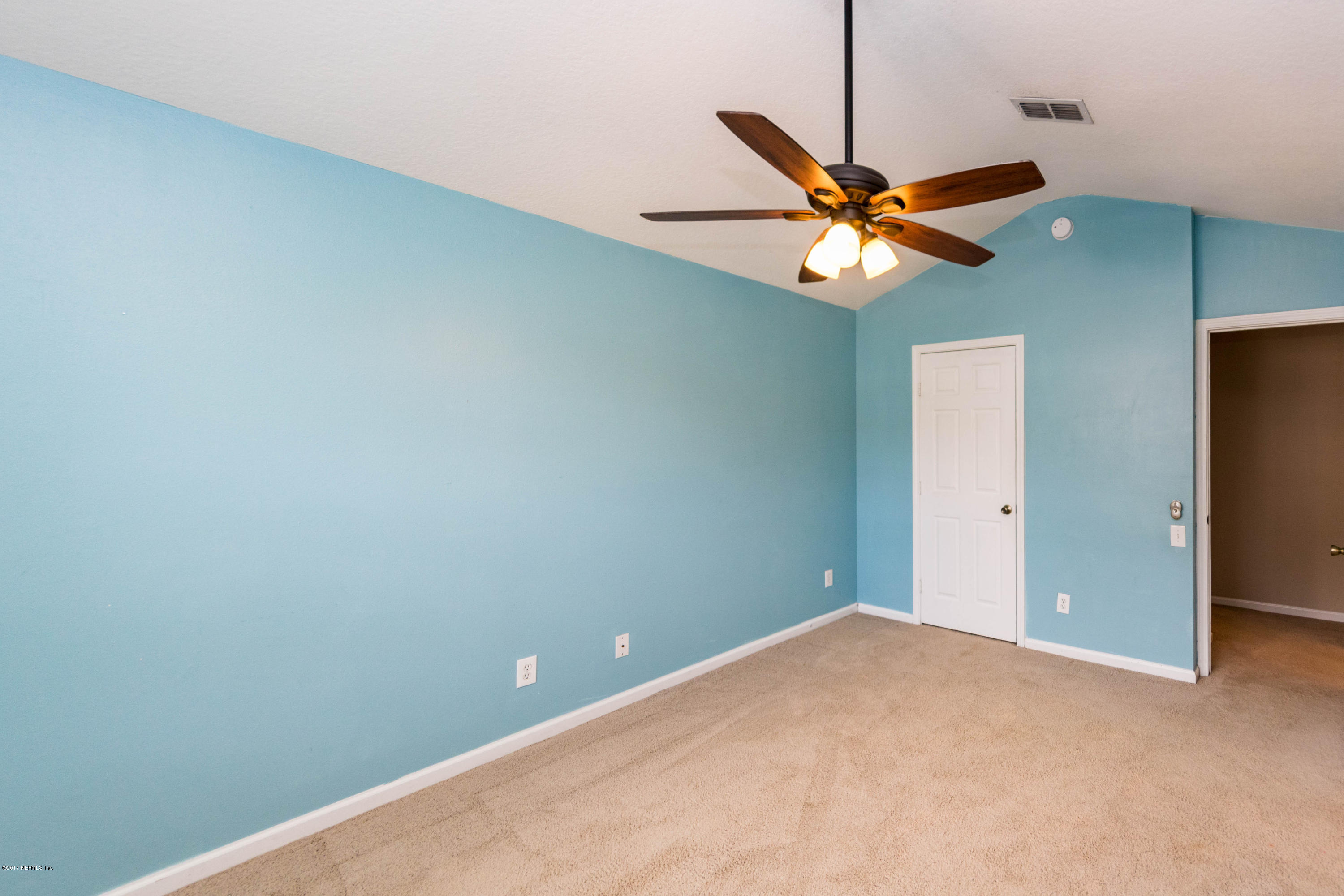 7990 Baymeadows Road East, Unit 1408 Jacksonville, FL 32256 - Photo 31 of 36 a view of a chandelier fan in a room
