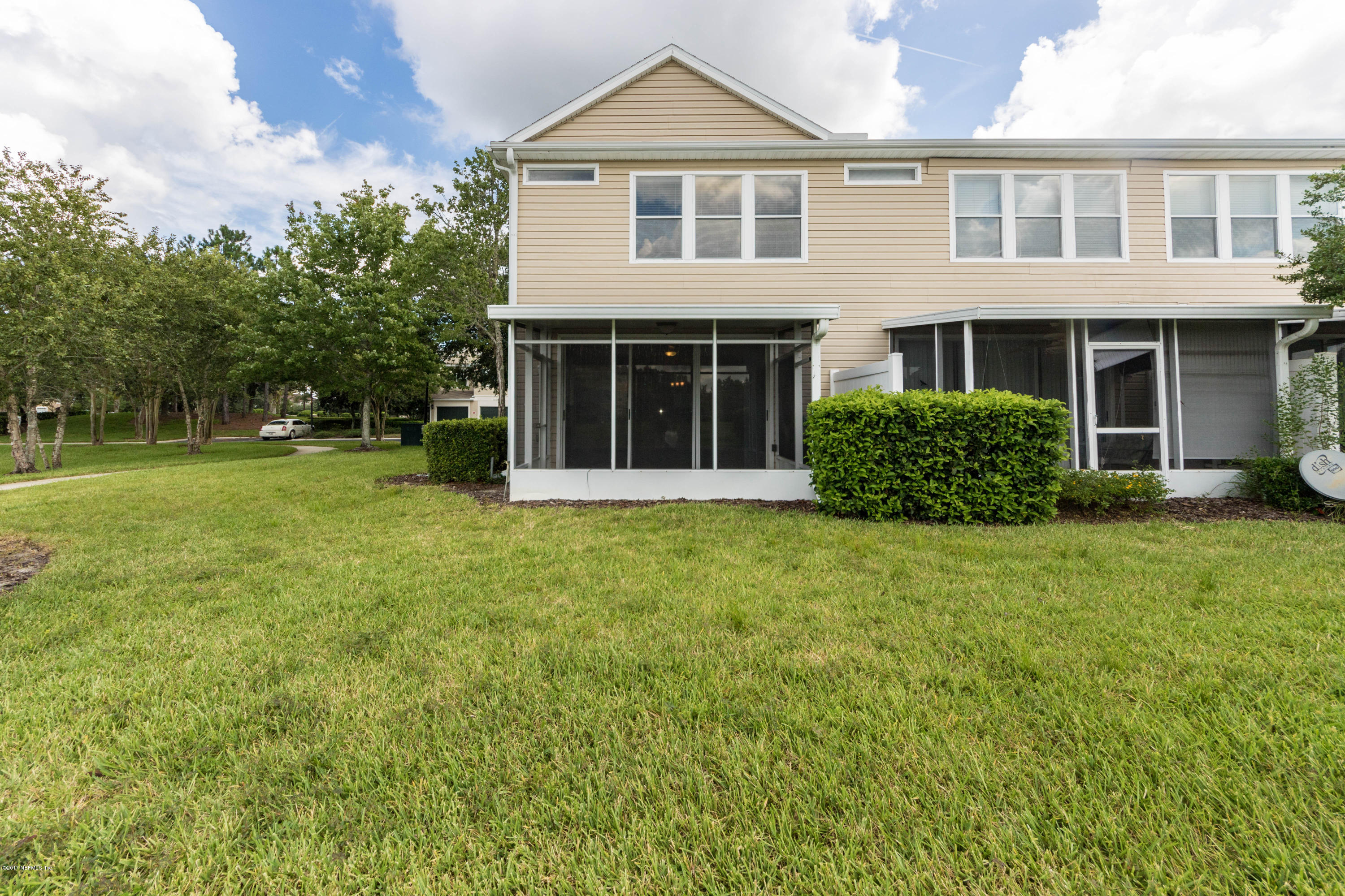7990 Baymeadows Road East, Unit 1408 Jacksonville, FL 32256 - Photo 34 of 36 a front view of a house with garden