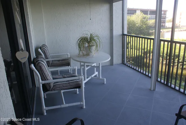 a view of a workspace with furniture
