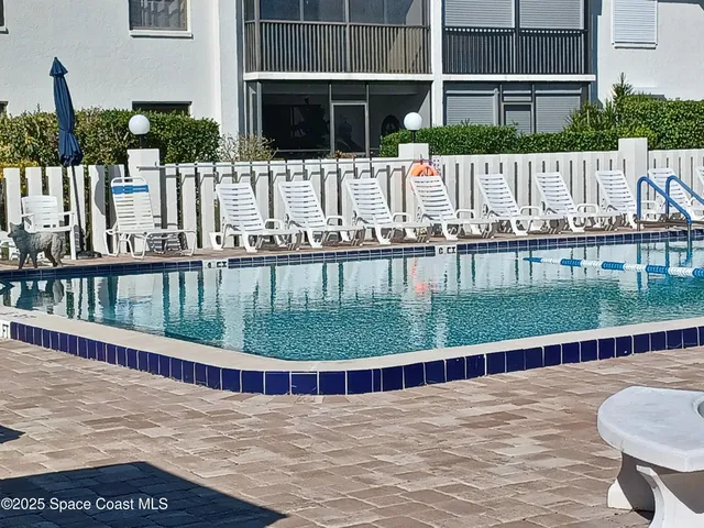 a view of swimming pool from a balcony