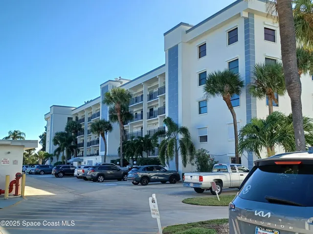 a view of multiple houses with a yard