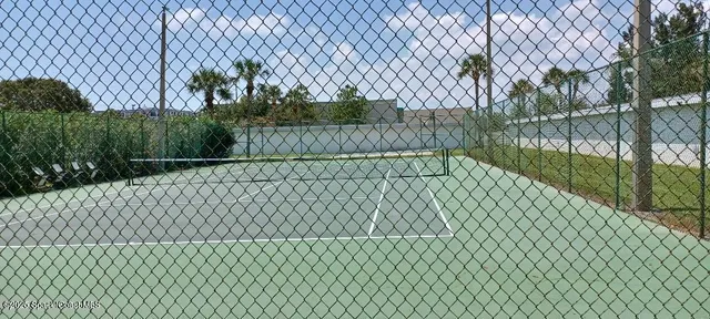 a view of a house with a yard patio and swimming pool