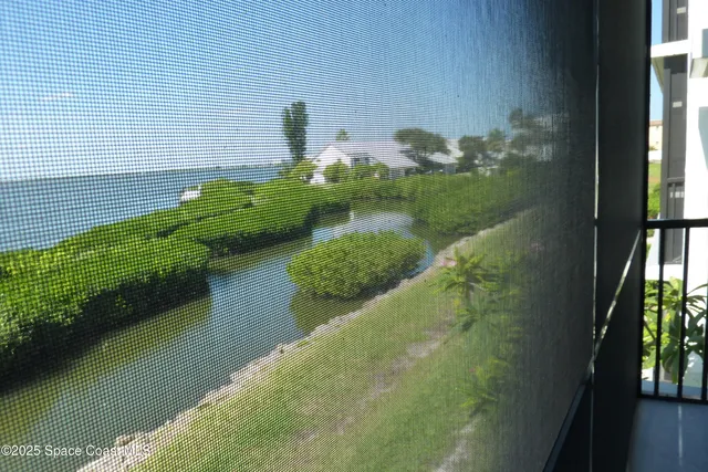 a view of swimming pool from a balcony