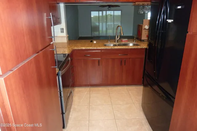 a bathroom with a granite countertop sink a mirror and vanity