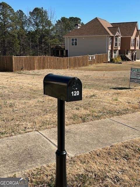 120 Bridgemill Drive Hampton, GA 30228 - Photo 10 of 11 a front view of a house with garden