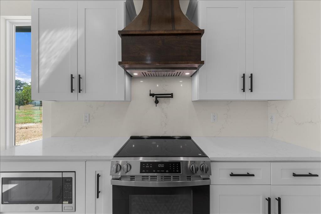 809 Fm 467 Seguin, TX 78155 - Photo 11 of 40 a stove top oven sitting inside of a kitchen