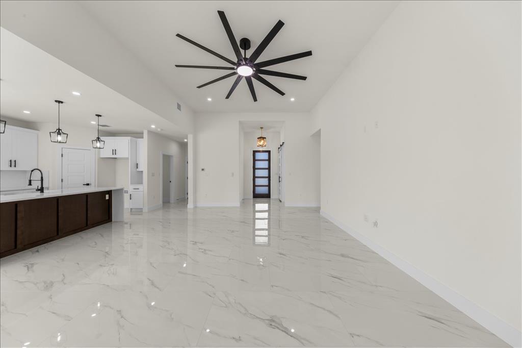 809 Fm 467 Seguin, TX 78155 - Photo 14 of 40 a view of a kitchen with a sink and a ceiling fan