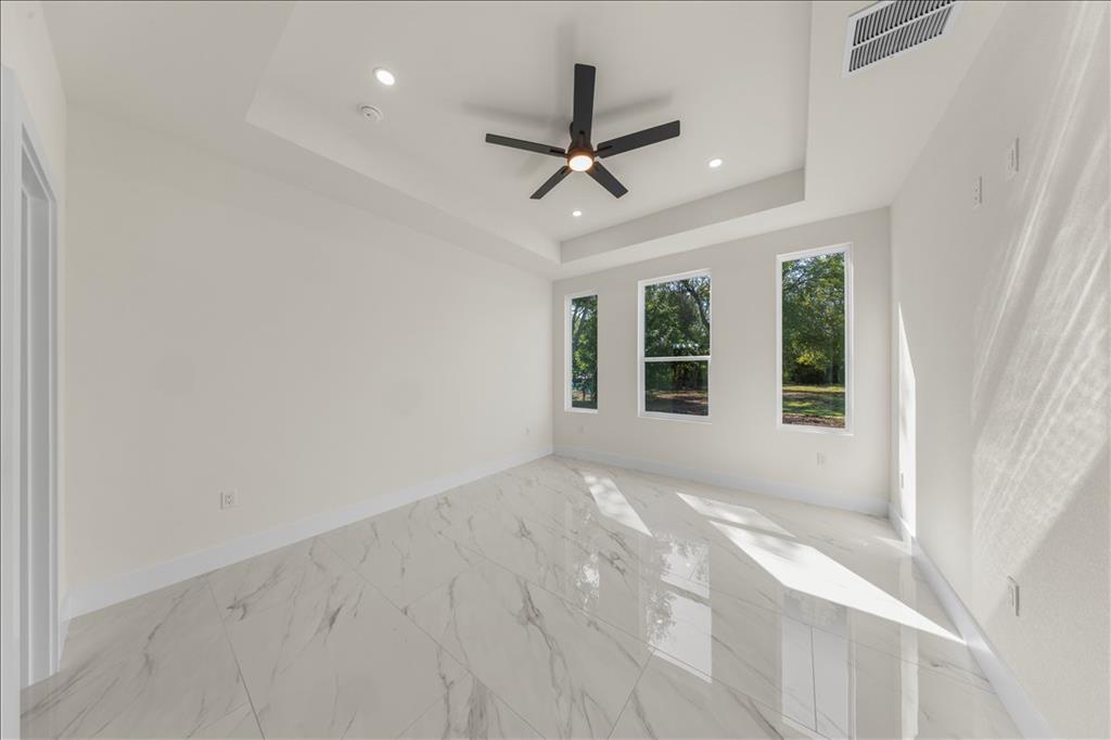 809 Fm 467 Seguin, TX 78155 - Photo 15 of 40 an empty room with windows and fan
