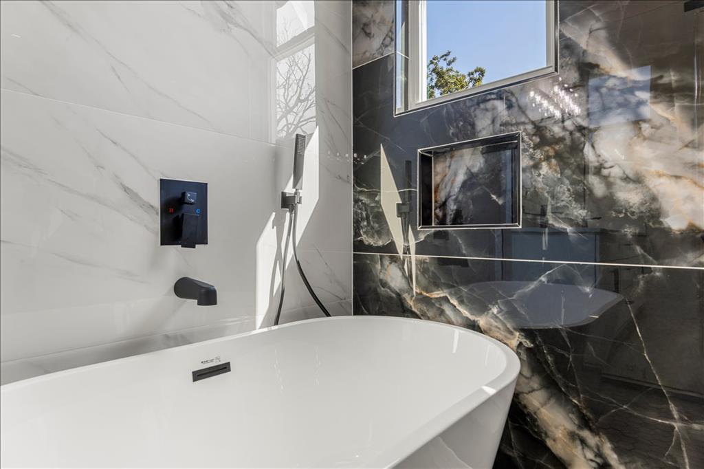 809 Fm 467 Seguin, TX 78155 - Photo 18 of 40 a bathroom with a sink a mirror and shower