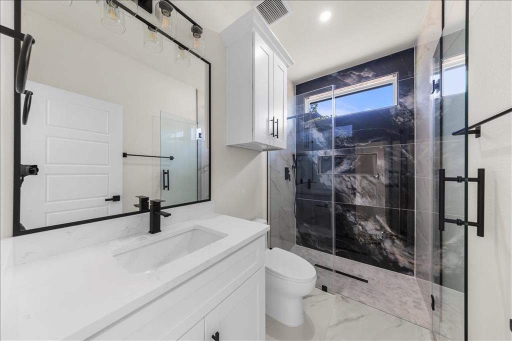 809 Fm 467 Seguin, TX 78155 - Photo 23 of 40 a bathroom with a sink toilet and shower