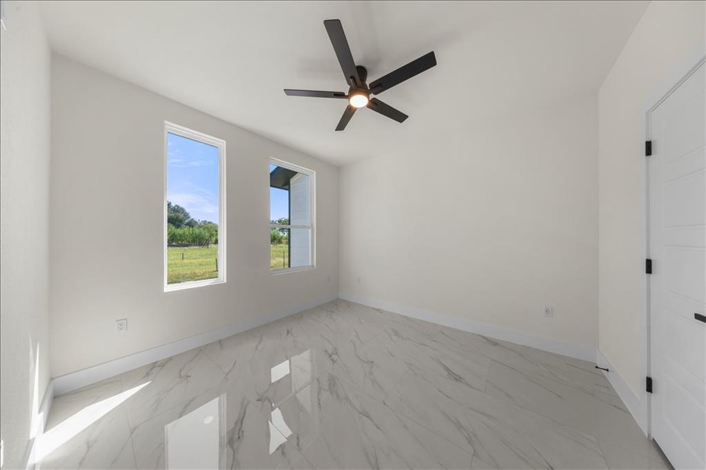 809 Fm 467 Seguin, TX 78155 - Photo 24 of 40 a view of a livingroom with a ceiling fan and window