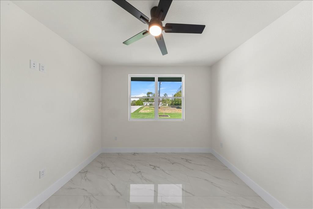 809 Fm 467 Seguin, TX 78155 - Photo 26 of 40 an empty room with a window and a ceiling fan