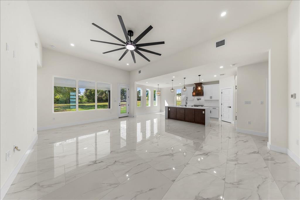 809 Fm 467 Seguin, TX 78155 - Photo 4 of 40 a living room with stainless steel appliances furniture and a chandelier
