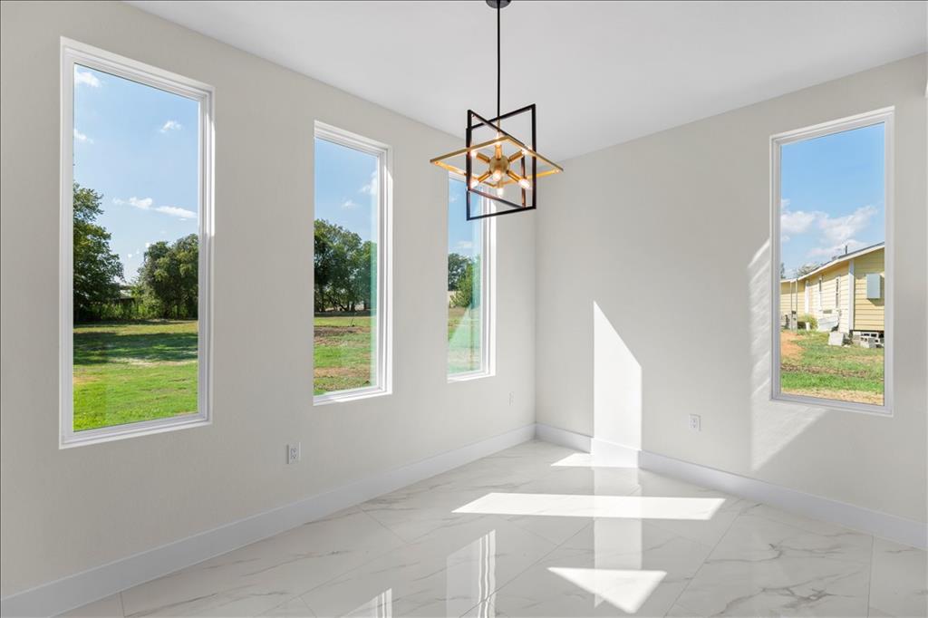 809 Fm 467 Seguin, TX 78155 - Photo 7 of 40 a view of an entryway with wooden floor and windows