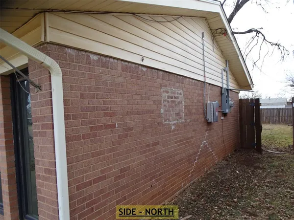 a view of a backyard of the house