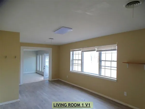 a view of an empty room with a window