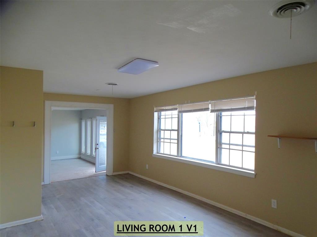 2002 Minter Lane Abilene, TX 79603 - Photo 3 of 16 a view of an empty room with a window
