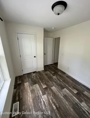 a view of a livingroom with wooden floor