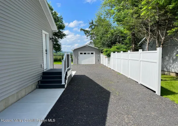 a backyard of a house with lots of green space
