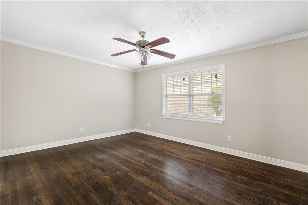 21 Delmont Drive Northeast, Unit 7 Atlanta, GA 30305 - Photo 16 of 22 a view of a room with wooden floor and windows
