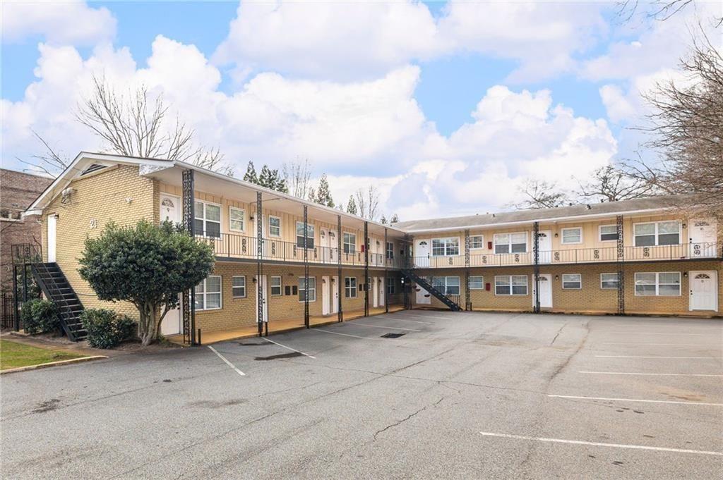 21 Delmont Drive Northeast, Unit 7 Atlanta, GA 30305 - Photo 22 of 22 a view of a white building that has a lots of windows in it