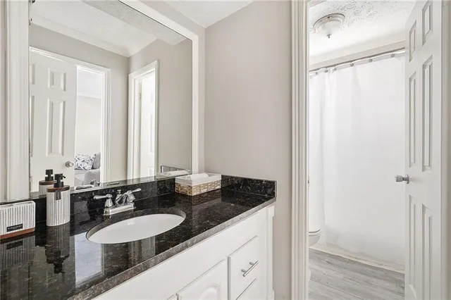 a bathroom with a double vanity sink and a mirror