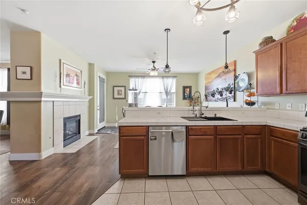 a kitchen with stainless steel appliances a refrigerator sink and cabinets