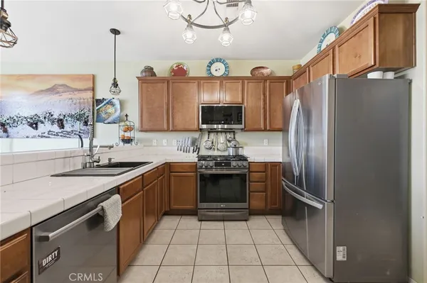 a kitchen with a sink and a refrigerator