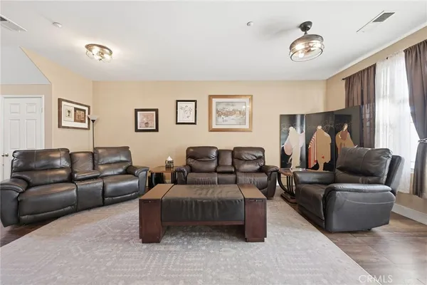 a view of a livingroom with furniture and a fireplace