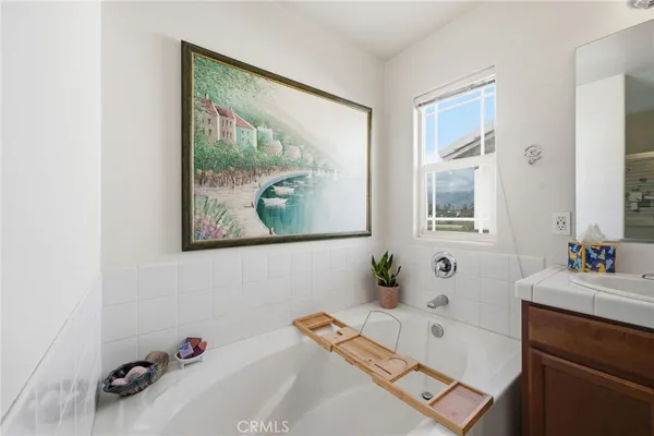 a living room with furniture and a view of bathroom