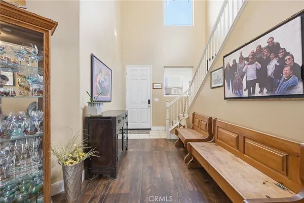 a kitchen with a sink stove and wooden floor