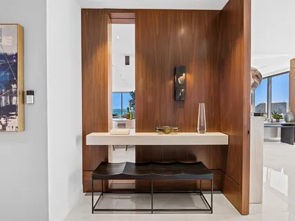a kitchen with kitchen island a counter top space cabinets and stainless steel appliances