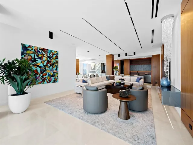 a bedroom with a bed couch and a flat screen tv